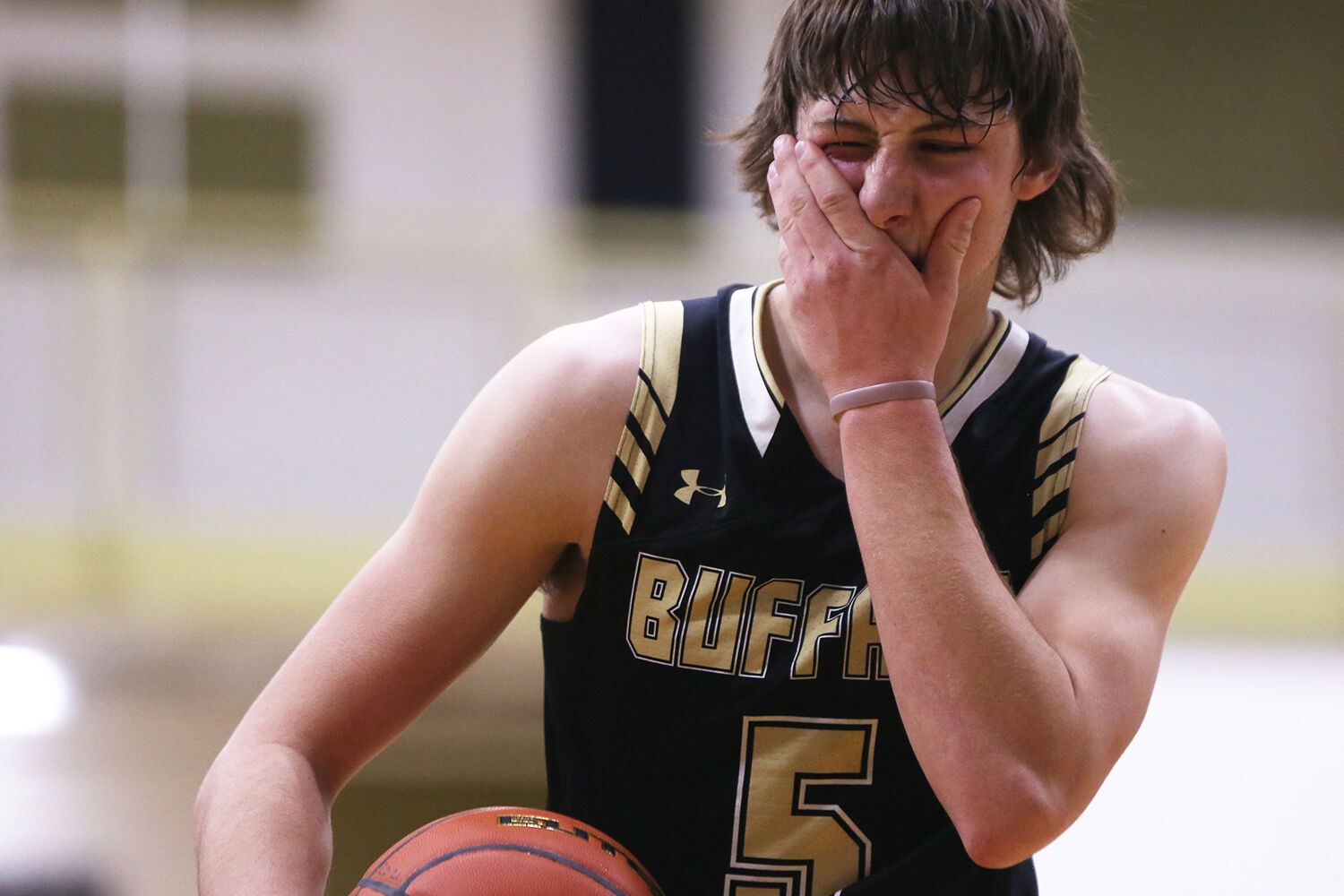 Hunter Stone grimaces after being hit in the face